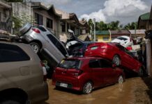 Cars swept away during floods triggered by Typhoon ‘Tino’