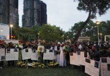 Mourners flock to site of deadly Hong Kong blaze as Beijing warns against protests