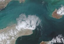 Both the US and Iran are firing on commercial ships in the Strait of Hormuz. Are both sides acting lawfully?