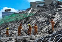 Rescuers search for more than 20 trapped after Philippines building collapse