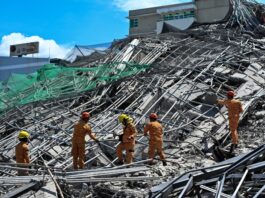 Rescuers search for more than 20 trapped after Philippines building collapse