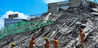 Rescuers search for more than 20 trapped after Philippines building collapse
