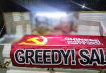 Philippines says it does not condone threats of violence after anti-China caskets found in Manila