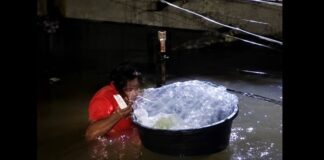 Baby Placed Inside Plastic Bag to Be Rescued From Deep Floodwaters