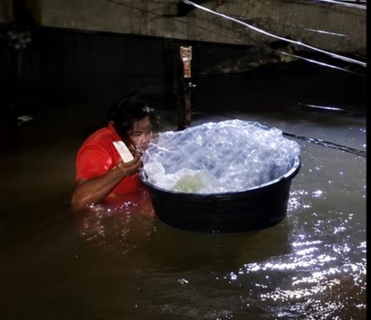 Baby Placed Inside Plastic Bag to Be Rescued From Deep Floodwaters
