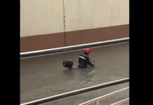 Rider Pushes Motorcycle Through Waist-Deep Flood in Makati