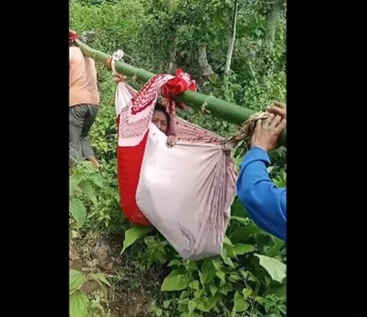 Elderly UPLIFT Program Beneficiary Carried Through Difficult Terrain to Attend Orientation